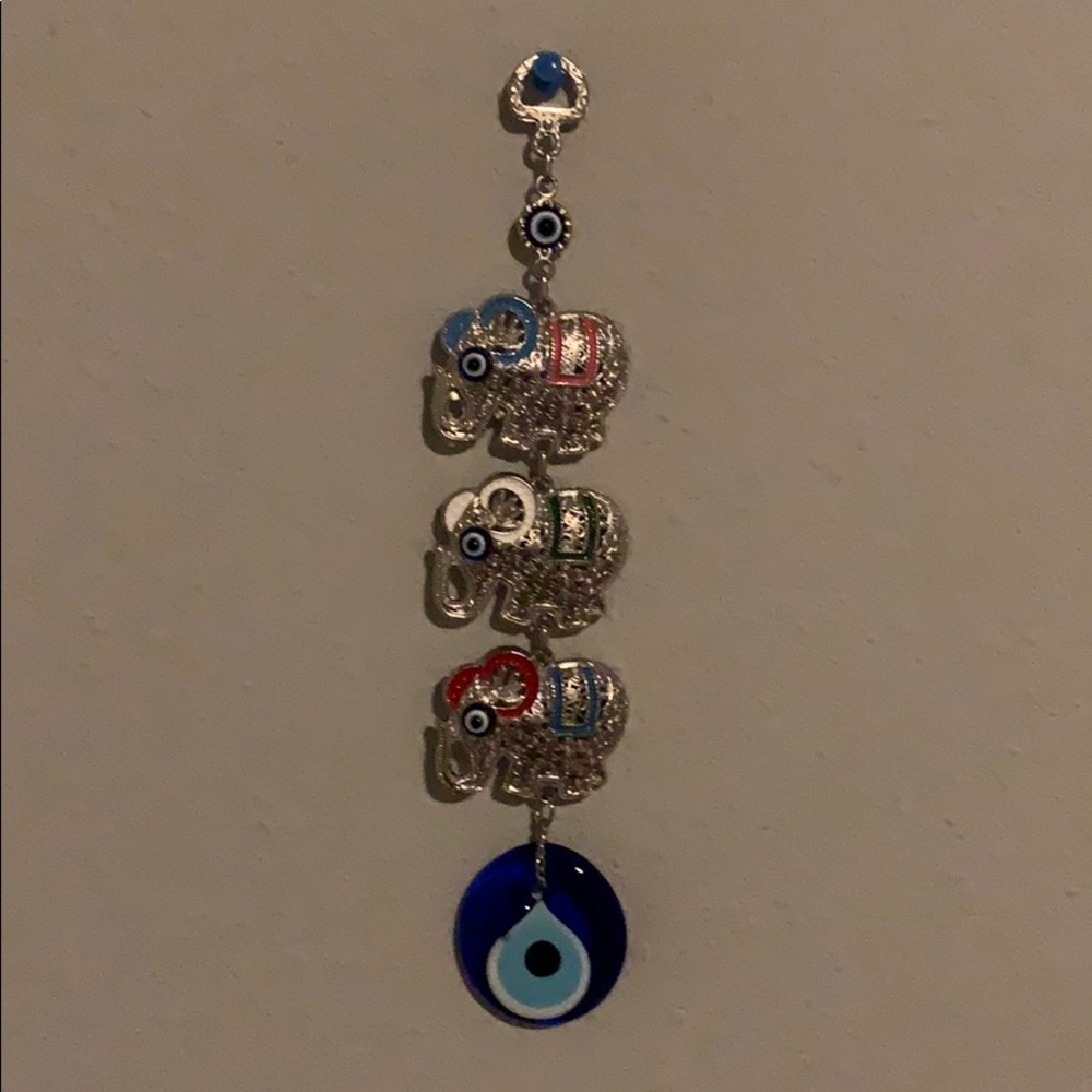 Wall hanging of elephants with Turkish evil eye